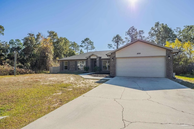 single story home with a front yard and a garage