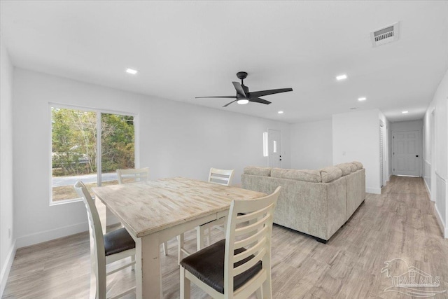 dining room featuring ceiling fan and light hardwood / wood-style flooring