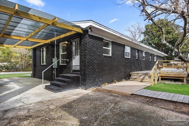 view of side of property with a wooden deck