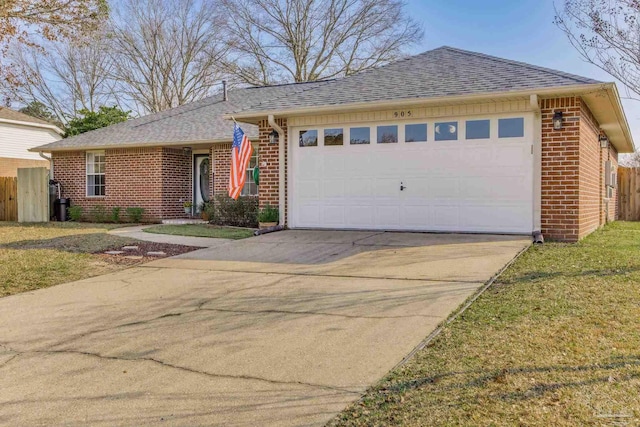 single story home featuring brick siding, a shingled roof, concrete driveway, fence, and a garage