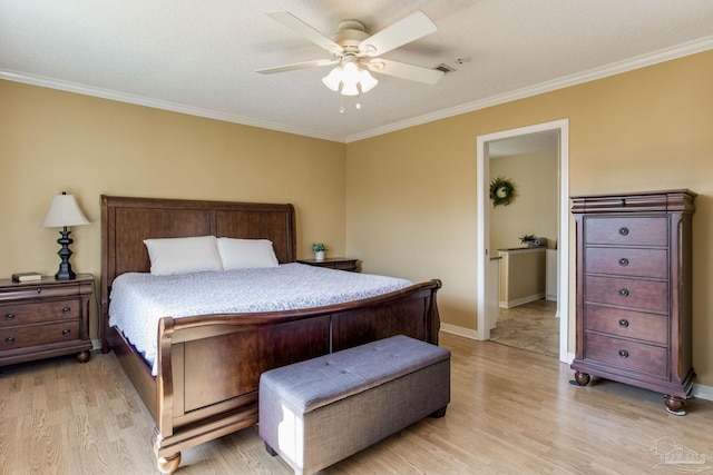 bedroom featuring ceiling fan, ornamental molding, baseboards, and light wood-style floors