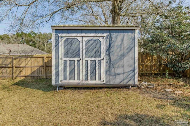 view of shed with a fenced backyard