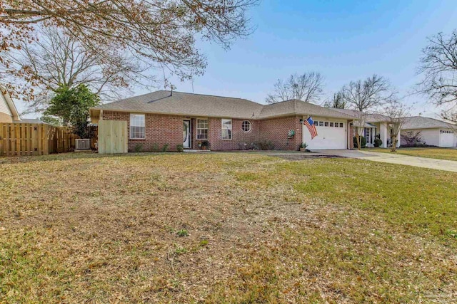 single story home with driveway, an attached garage, fence, a front yard, and brick siding