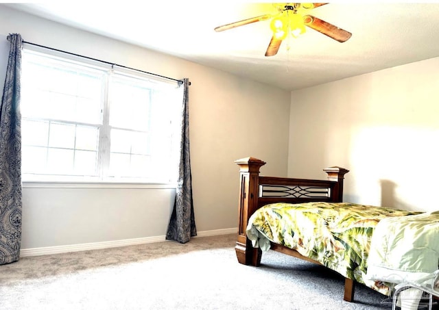 bedroom featuring carpet flooring, baseboards, and ceiling fan