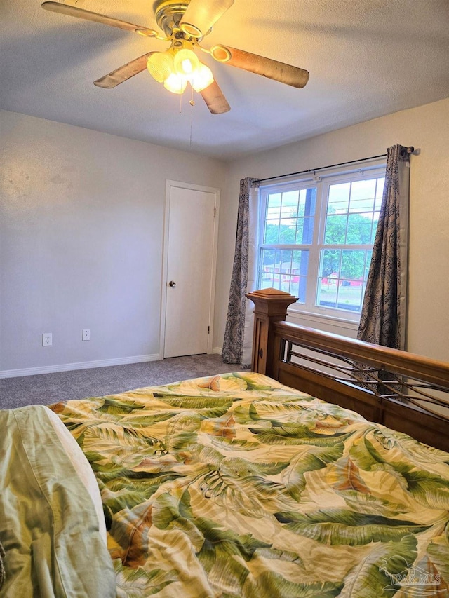 bedroom featuring baseboards, carpet, and a ceiling fan