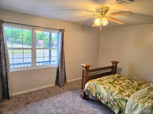 bedroom with visible vents, a ceiling fan, carpet, and baseboards