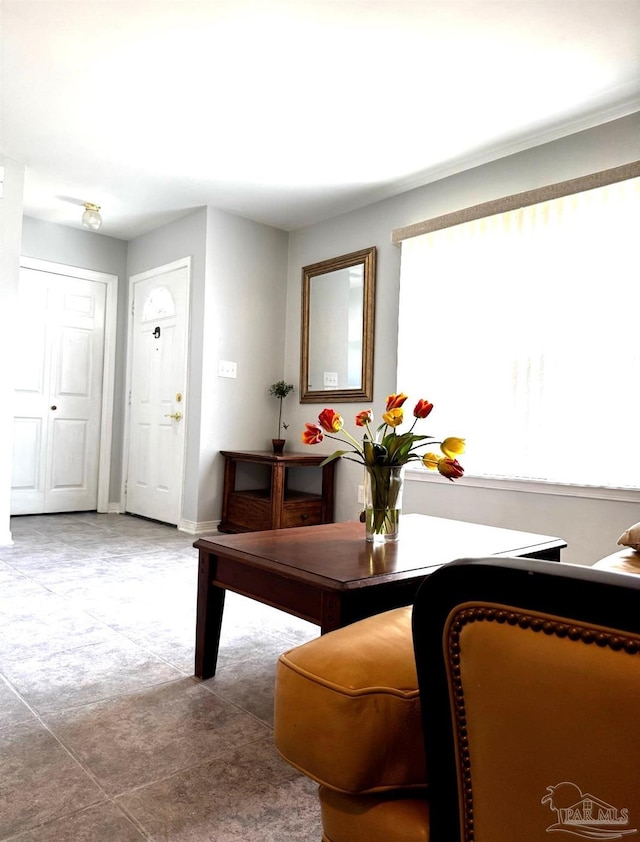 dining area with baseboards and carpet