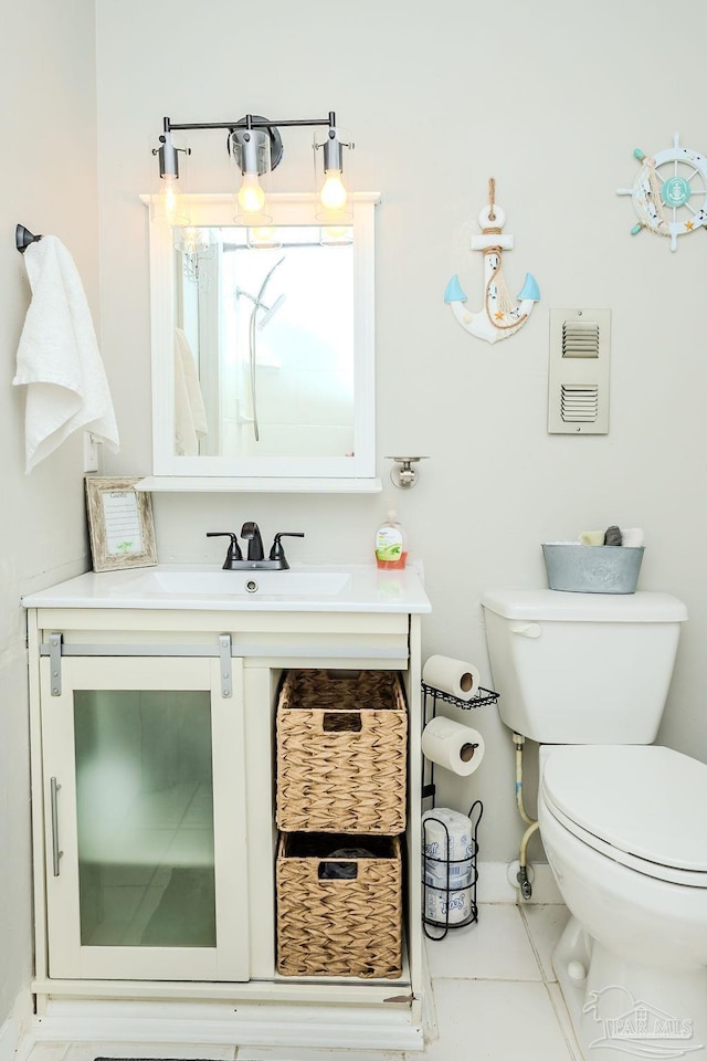 bathroom with visible vents, tile patterned flooring, vanity, and toilet