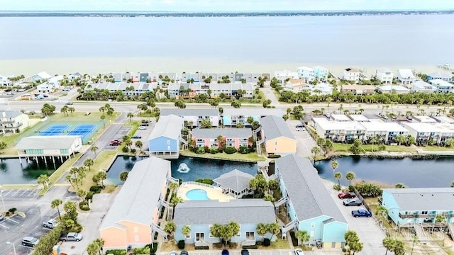 birds eye view of property featuring a residential view and a water view