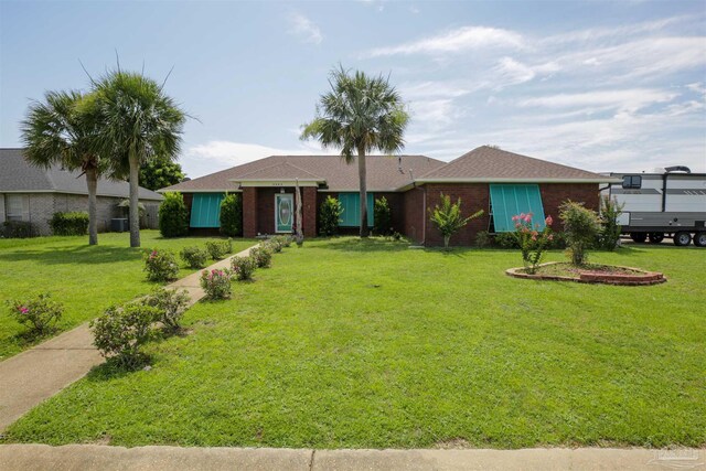 ranch-style house with a front lawn