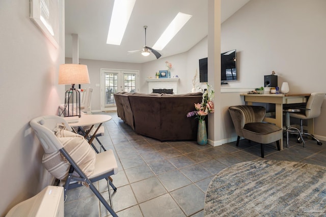 living room featuring lofted ceiling, french doors, tile patterned flooring, and ceiling fan