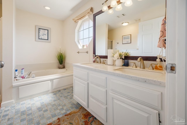 bathroom with vanity and separate shower and tub