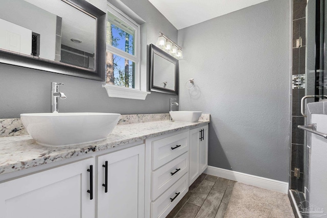 bathroom with vanity and walk in shower