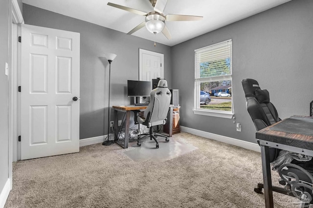 home office featuring carpet and ceiling fan