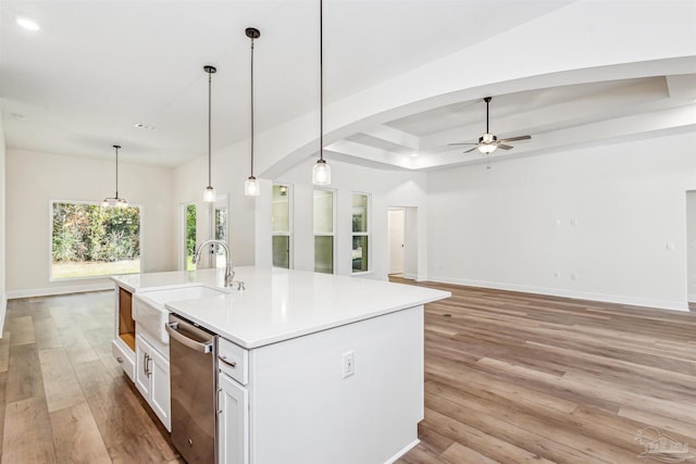 6563 Gentle Rain Dr, Milton, FL 32570 - kitchen with dishwasher, a sink, a ceiling fan, light wood finished floors, and white cabinets