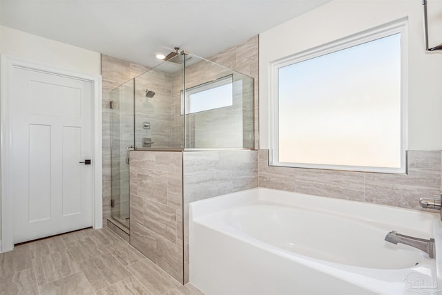 6563 Gentle Rain Dr, Milton, FL 32570 - full bath featuring a garden tub and a shower stall