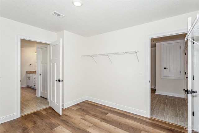 6563 Gentle Rain Dr, Milton, FL 32570 - spacious closet featuring wood finished floors