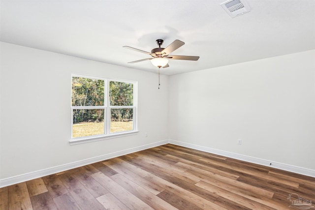 6563 Gentle Rain Dr, Milton, FL 32570 - spare room with ceiling fan, baseboards, and hardwood / wood-style floors