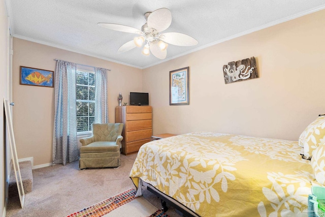 bedroom with ornamental molding, carpet floors, a textured ceiling, and ceiling fan