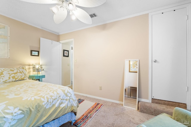 carpeted bedroom featuring crown molding and ceiling fan