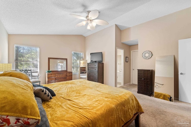 bedroom featuring ceiling fan, vaulted ceiling, carpet, and a textured ceiling