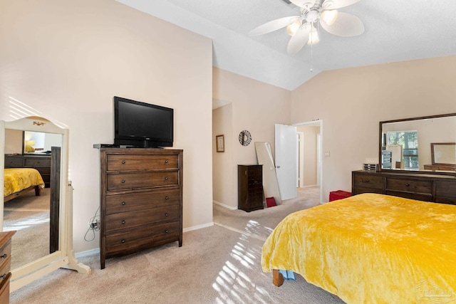 bedroom featuring lofted ceiling, light colored carpet, and ceiling fan