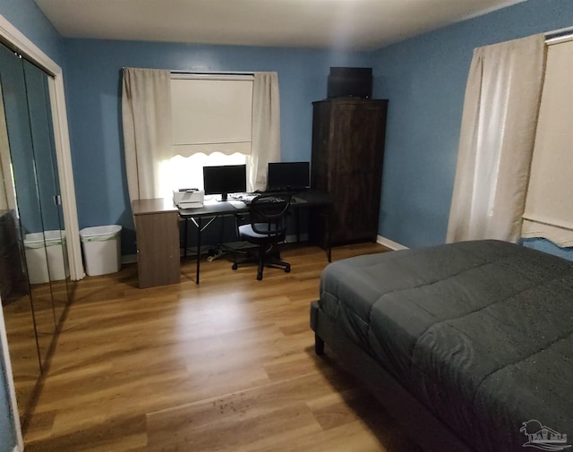 bedroom with wood-type flooring