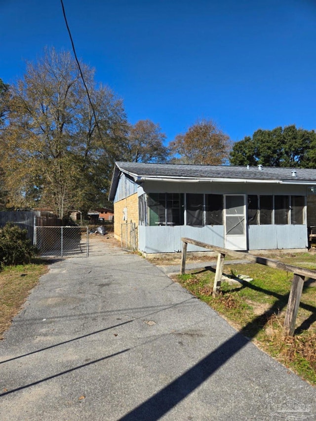 view of front facade with a sunroom