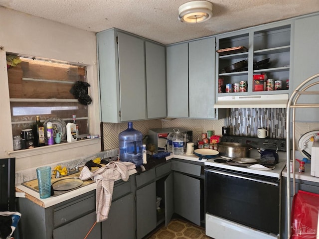 kitchen featuring white electric range and gray cabinetry