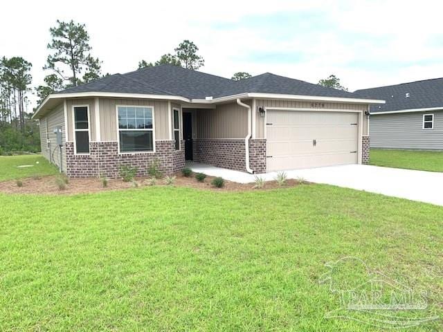 view of front of home with a garage and a front lawn