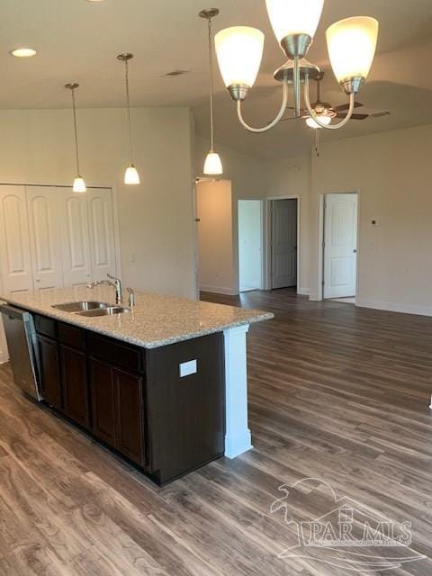 kitchen featuring dark brown cabinetry, sink, hanging light fixtures, dark hardwood / wood-style flooring, and dishwasher