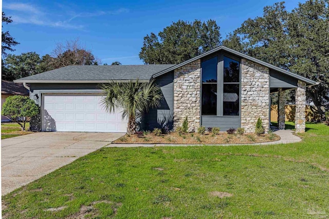 view of front of home with a front lawn and a garage