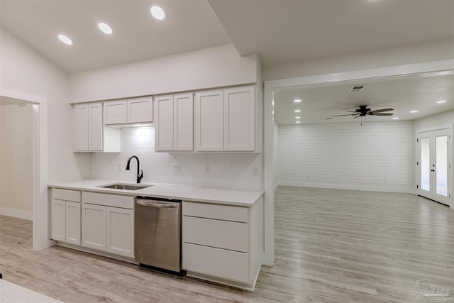 kitchen with stainless steel dishwasher, ceiling fan, white cabinets, and sink