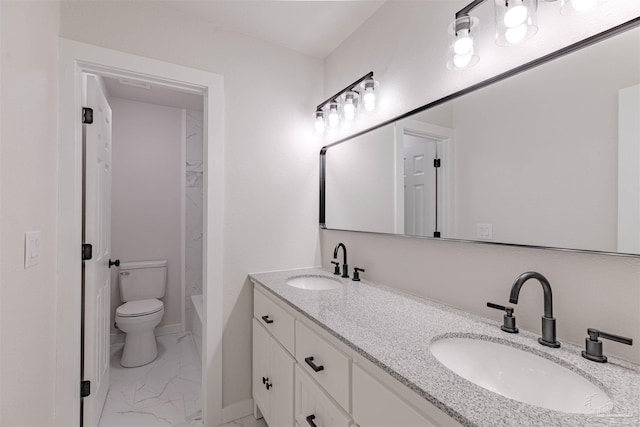 bathroom featuring vanity and toilet