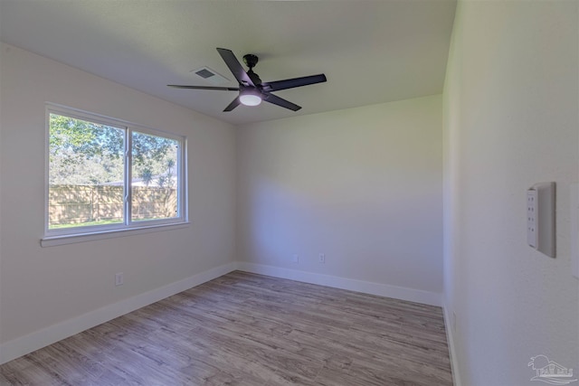 spare room featuring ceiling fan and light hardwood / wood-style floors