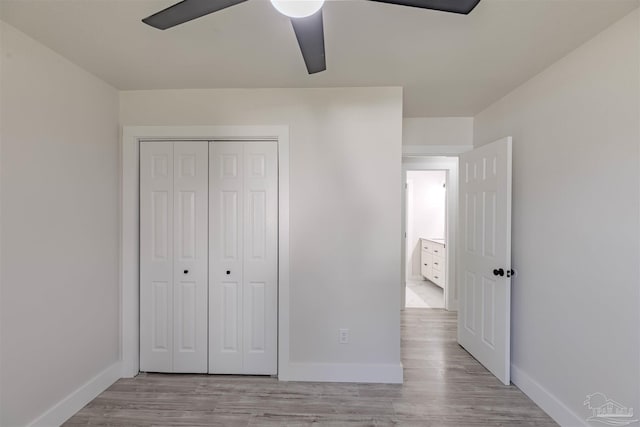 unfurnished bedroom with a closet, ceiling fan, and light hardwood / wood-style floors