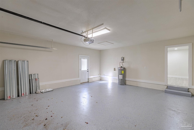 garage with a garage door opener and water heater