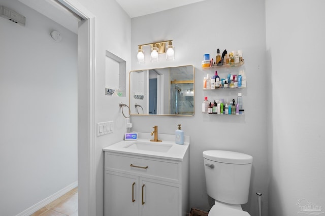 bathroom with tile patterned flooring, toilet, and vanity