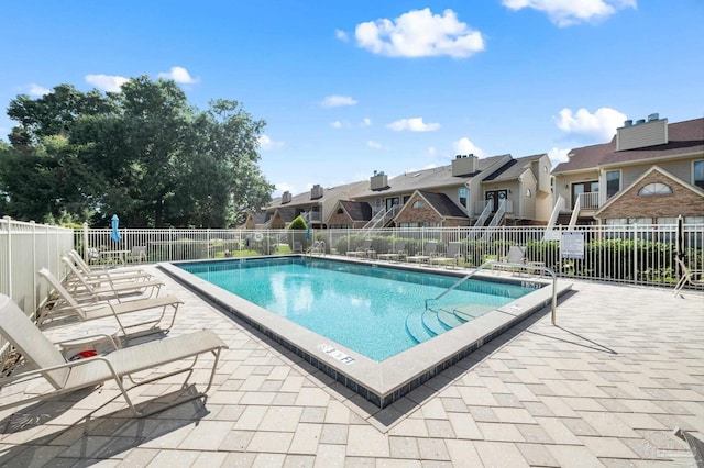 view of swimming pool with a patio area