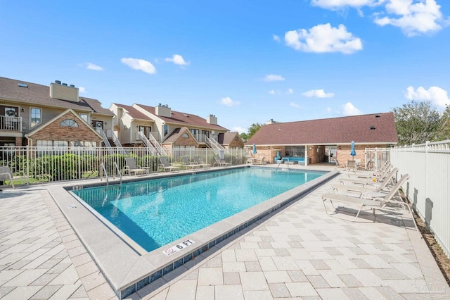 view of swimming pool with a patio