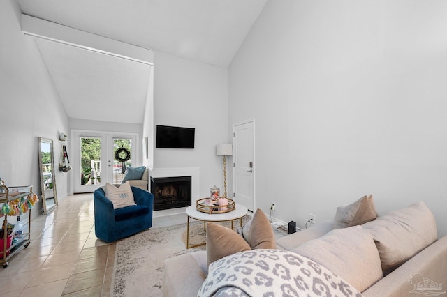 tiled living room featuring high vaulted ceiling