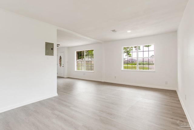 8123 Mobile Hwy, Pensacola, FL 32526 - unfurnished room with plenty of natural light, electric panel, wood finished floors, baseboards, and recessed lighting