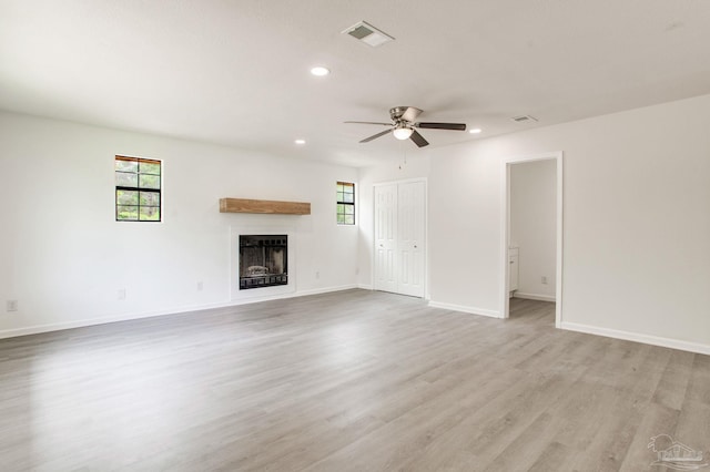 8123 Mobile Hwy, Pensacola, FL 32526 - unfurnished living room with recessed lighting, a fireplace, light wood finished floors, ceiling fan, and baseboards