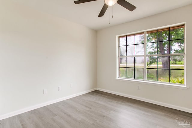 8123 Mobile Hwy, Pensacola, FL 32526 - unfurnished room with light wood-type flooring, a ceiling fan, and baseboards