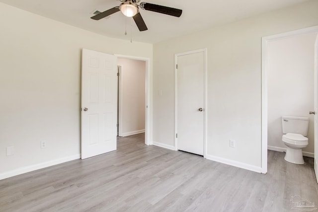 8123 Mobile Hwy, Pensacola, FL 32526 - unfurnished bedroom with light wood finished floors, baseboards, and ceiling fan