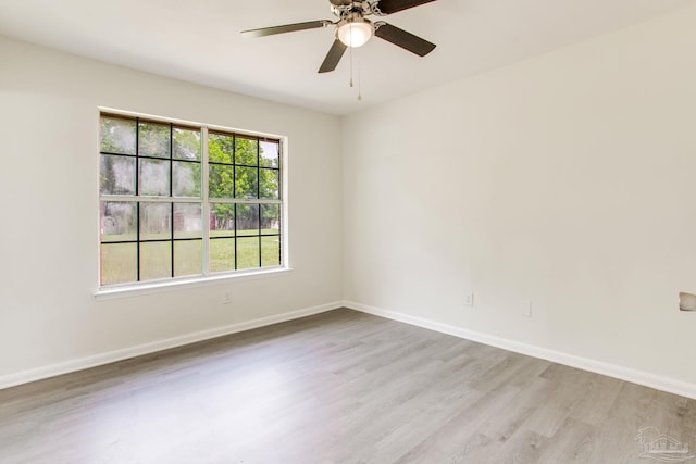8123 Mobile Hwy, Pensacola, FL 32526 - spare room featuring light wood-type flooring, baseboards, and a ceiling fan