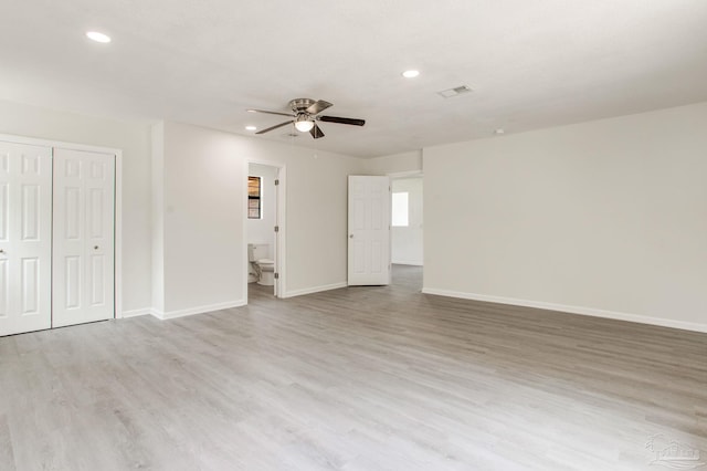 8123 Mobile Hwy, Pensacola, FL 32526 - unfurnished living room with ceiling fan, light wood finished floors, baseboards, and recessed lighting