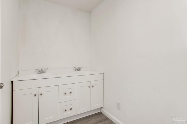 8123 Mobile Hwy, Pensacola, FL 32526 - bathroom with wood finished floors, double vanity, and baseboards
