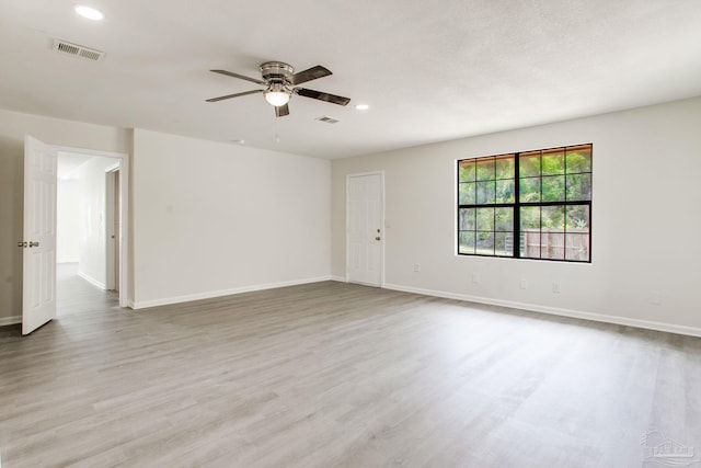 8123 Mobile Hwy, Pensacola, FL 32526 - spare room featuring a ceiling fan, wood finished floors, recessed lighting, and baseboards