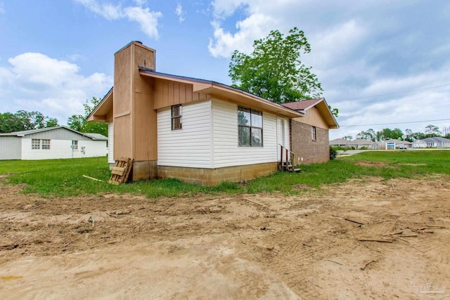8123 Mobile Hwy, Pensacola, FL 32526 - view of home's exterior with a chimney